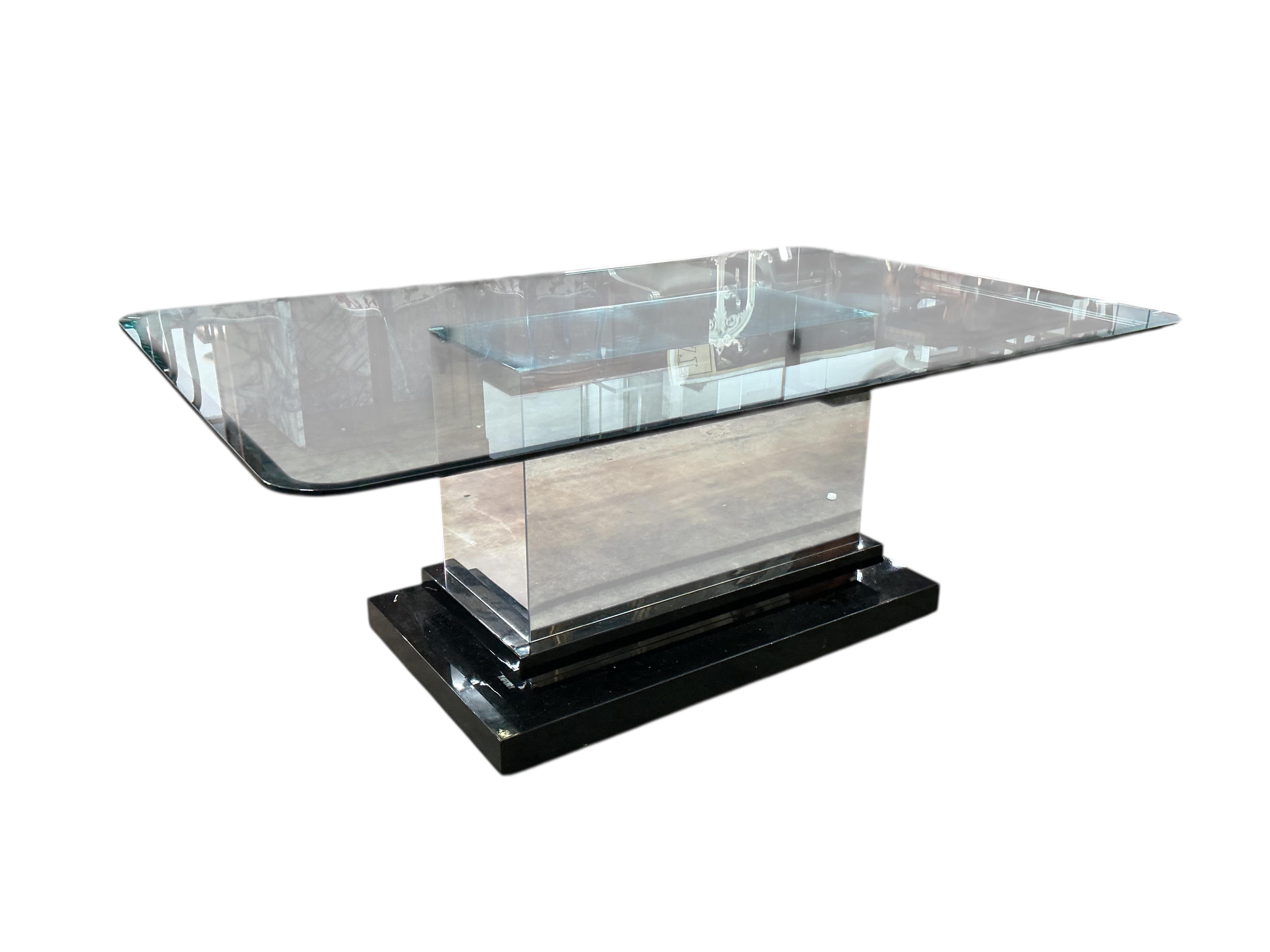 A Contemporary rectangular glass dining table on central mirrored block with ebonised plinth foot, width 200cm, depth 130cm, height 75cm